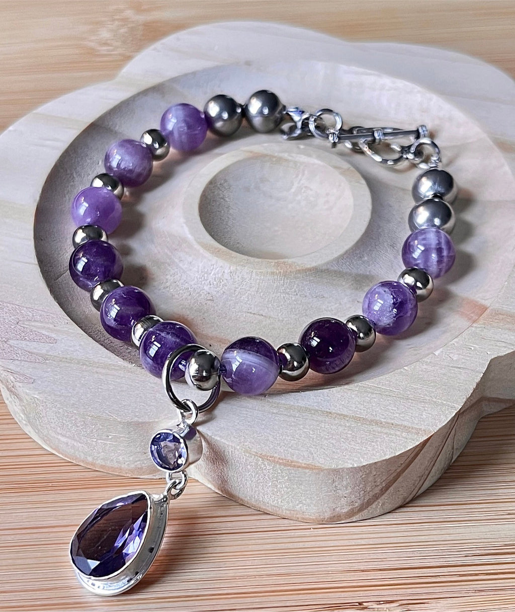 Amethyst bracelet. Pretty purple amethysts with chevron pattern crystallization! 8mm beads with durable stainless steel bracelet hardware!