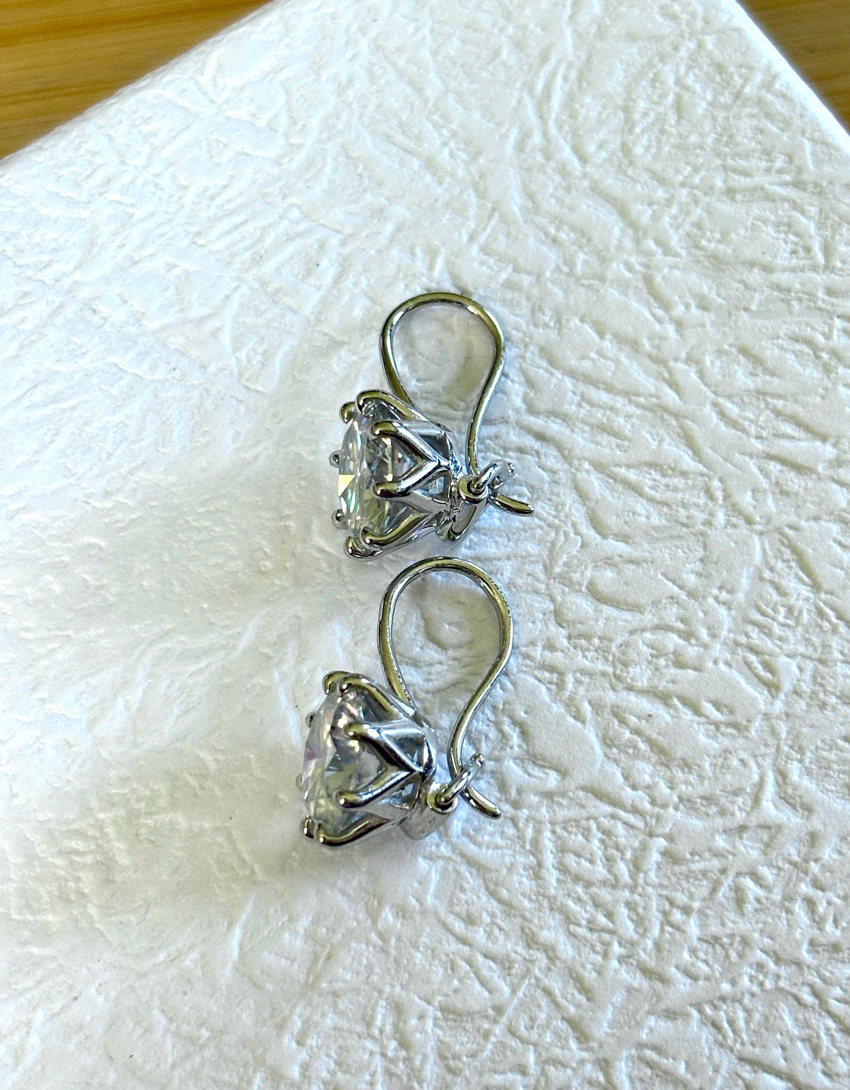 Moissanite earrings. Exclusive 8ctw double certified Moissanite fish hook earrings with *buckle backs* in 935 Argentium silver and 18k white rhodium!