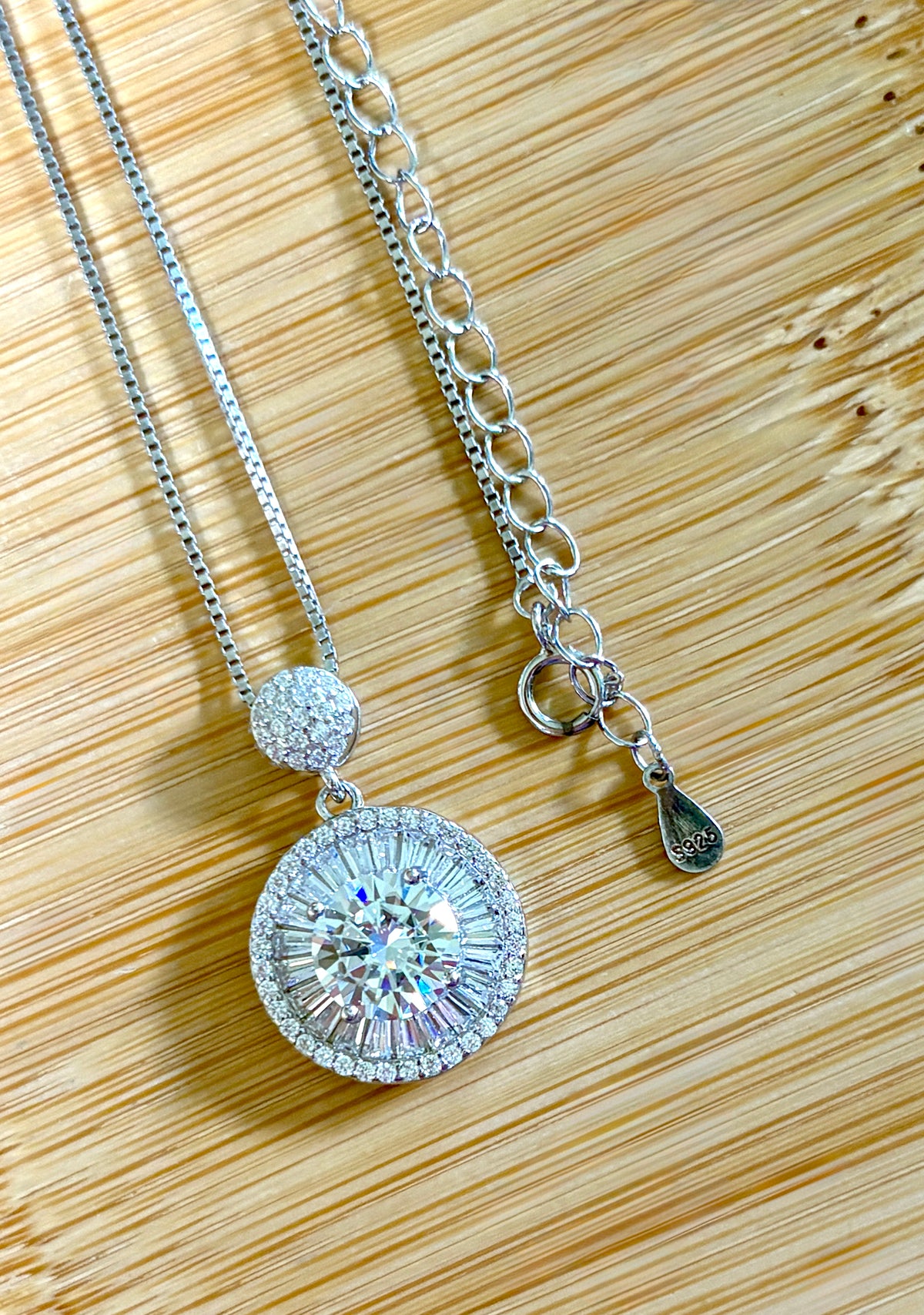 Moissanite necklace. The certified 2ct Moissanite “Sunburst” necklace with a 61 gemstone pendant plus more in the bail! Radiantly beautiful!