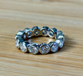 Moissanite ring. A certified, bezel-set eternity ring with 1/2ct round brilliant Moissanites set in a heavy, solid Argentium silver band!