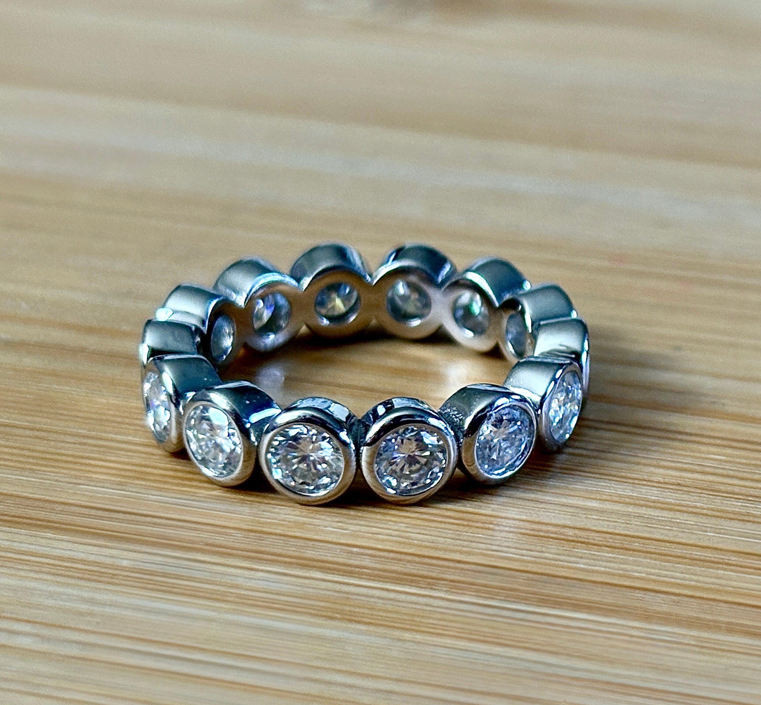 Moissanite ring. A certified, bezel-set eternity ring with 1/2ct round brilliant Moissanites set in a heavy, solid Argentium silver band!