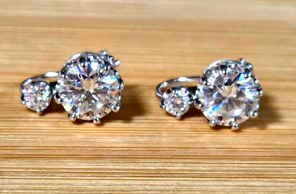 A Victorian inspired 4.2cttw certified pair of Moissanite 2-stone buckle back earrings in Argentium silver! Minimalist glam!