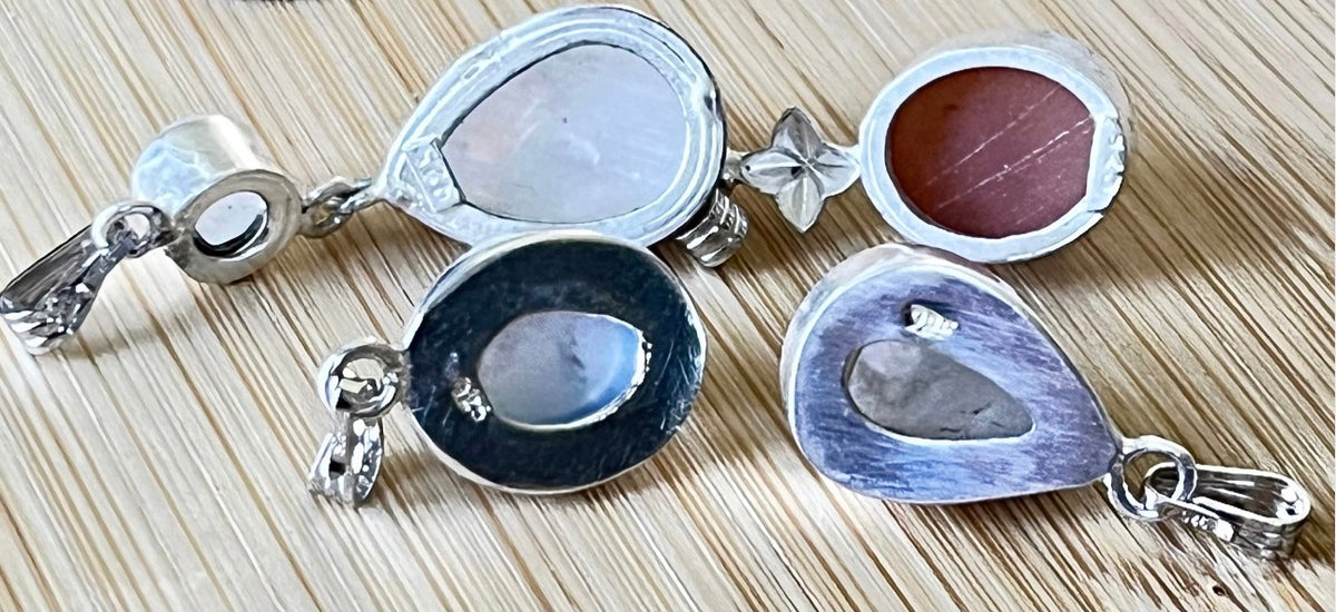 Moonstone, peach moonstone and lab “aurora” opal pendants in sterling silver!