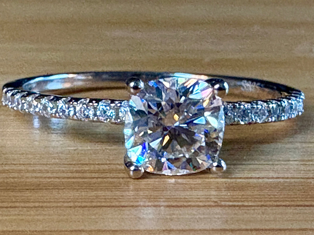 Moissanite solitaire. A certified 1ct cushion-cut Moissanite with pavé-set zircons in 925 sterling OR pavé-set Moissanites in 935 Argentium!
