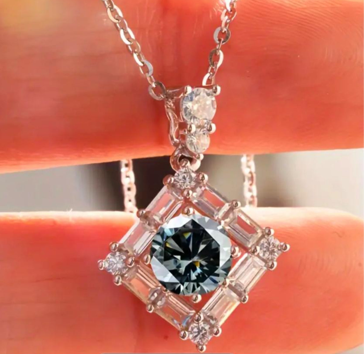 Moissanite necklace. A transfixingly gray 1ct certified round brilliant Moissanite centered in a halo of white zircons - a 2.25cttw pendant!