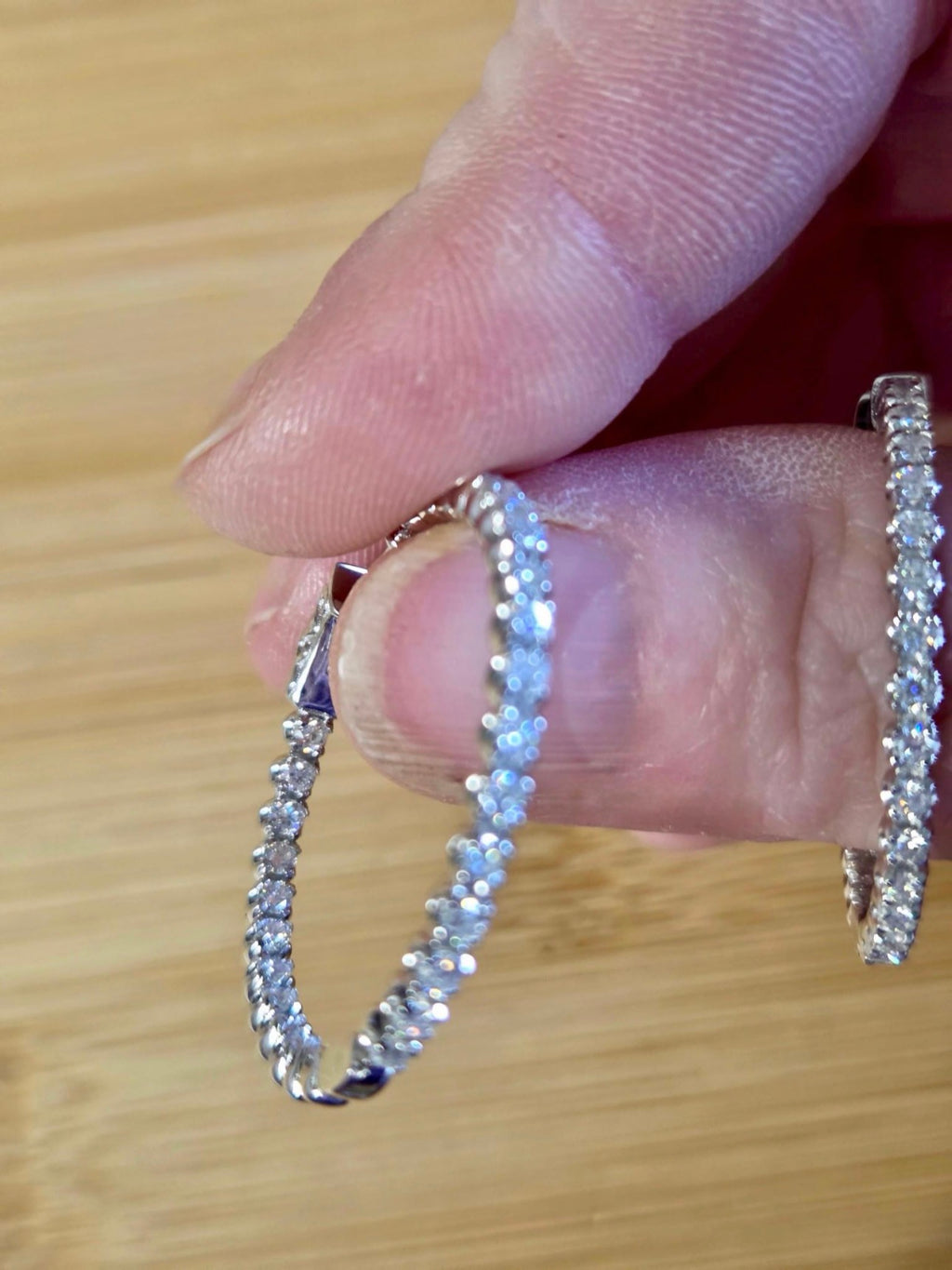 Moissanite hoops. These 1.8ctw Moissanite inside-out hoops *lock* in place so you can take your style from the office to the dance floor! So boogie down!