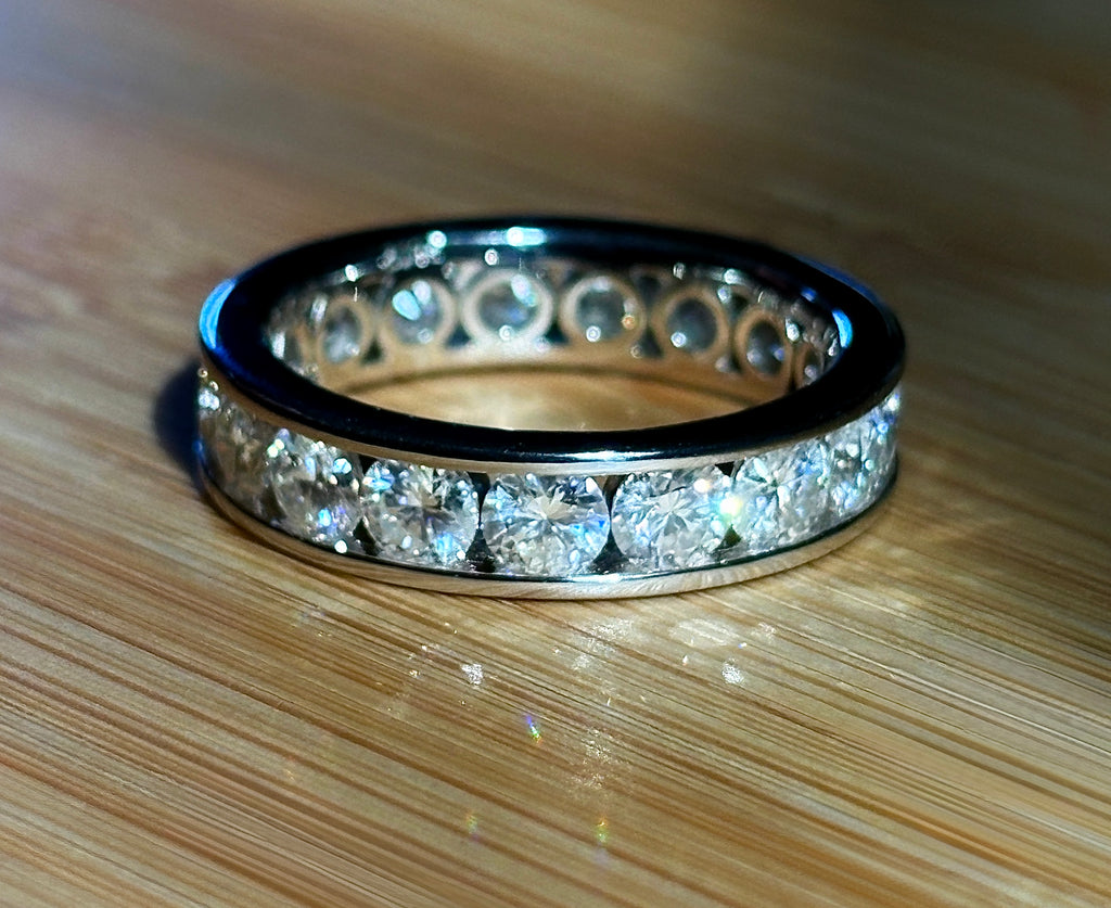 Moissanite ring. A 5.10cttw or 4.8cttw (depending on size) Moissanite eternity ring. A channel-set, classy and classic design - beautiful!