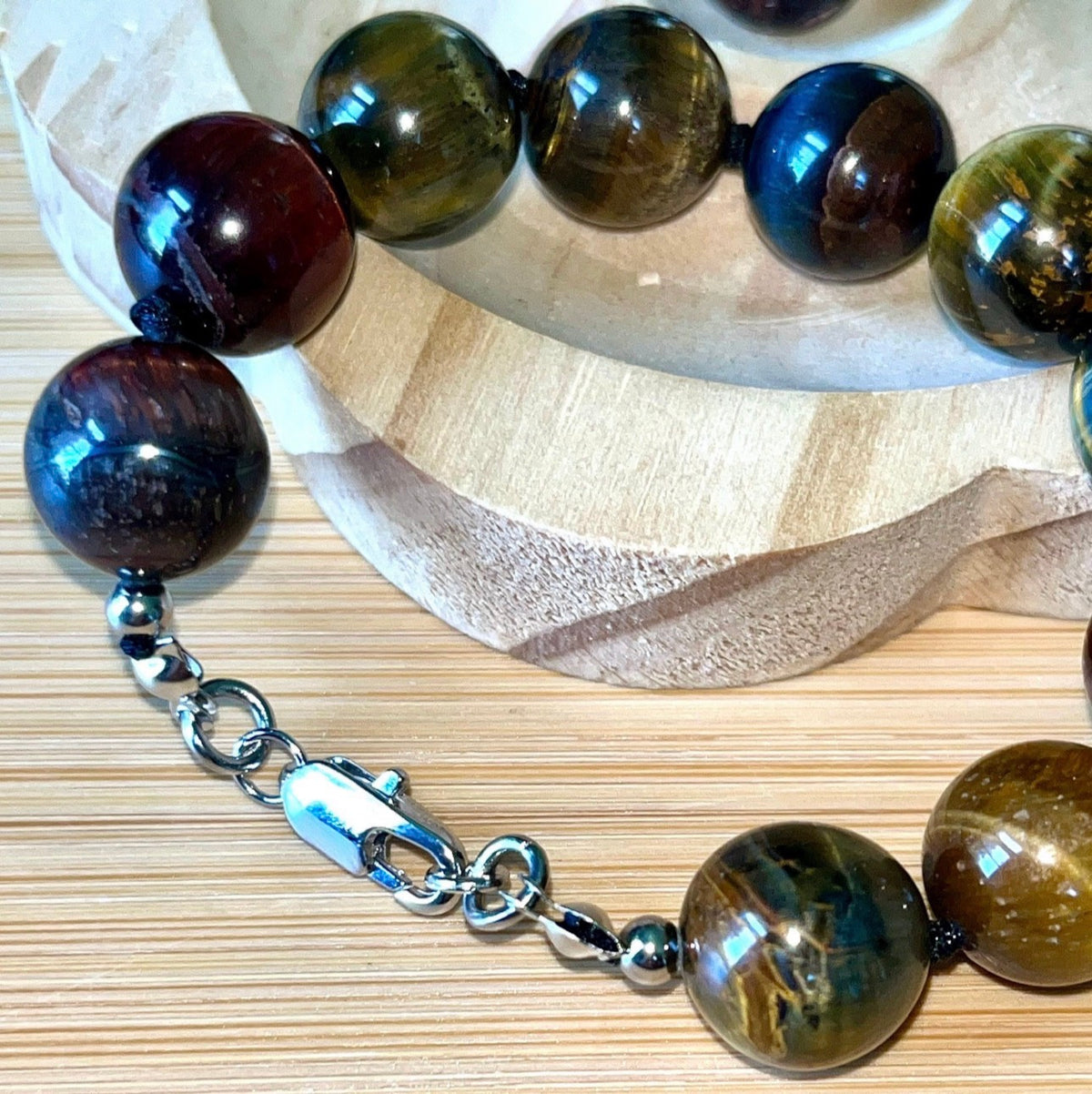 Tiger’s eye bracelet. 100% natural, highly chatoyant 14mm tricolored tiger’s eye hand knotted bracelet! Also available without the knots!