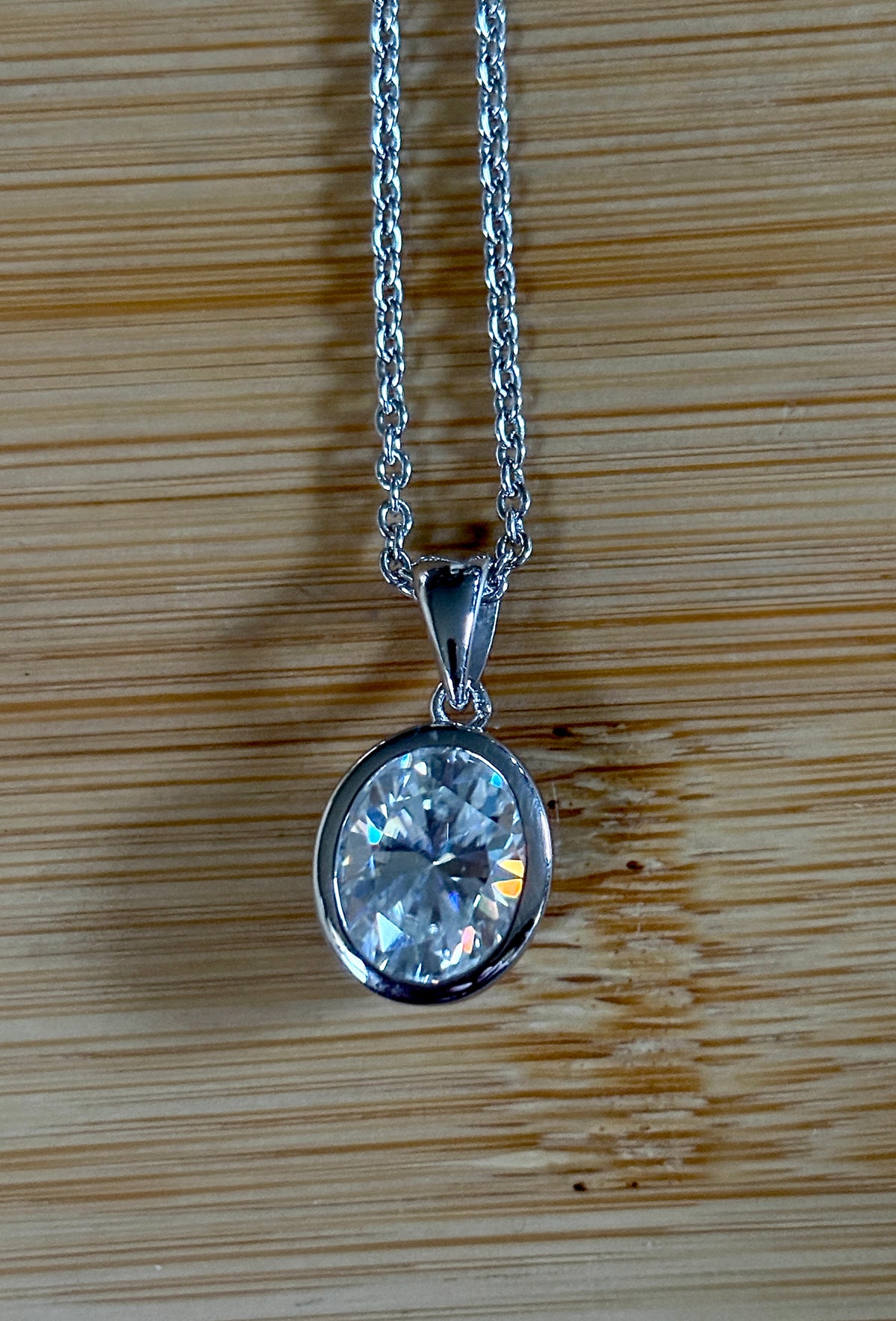 Moissanite solitaire necklace. A certified 5ct oval Moissanite in sterling silver and 18k!