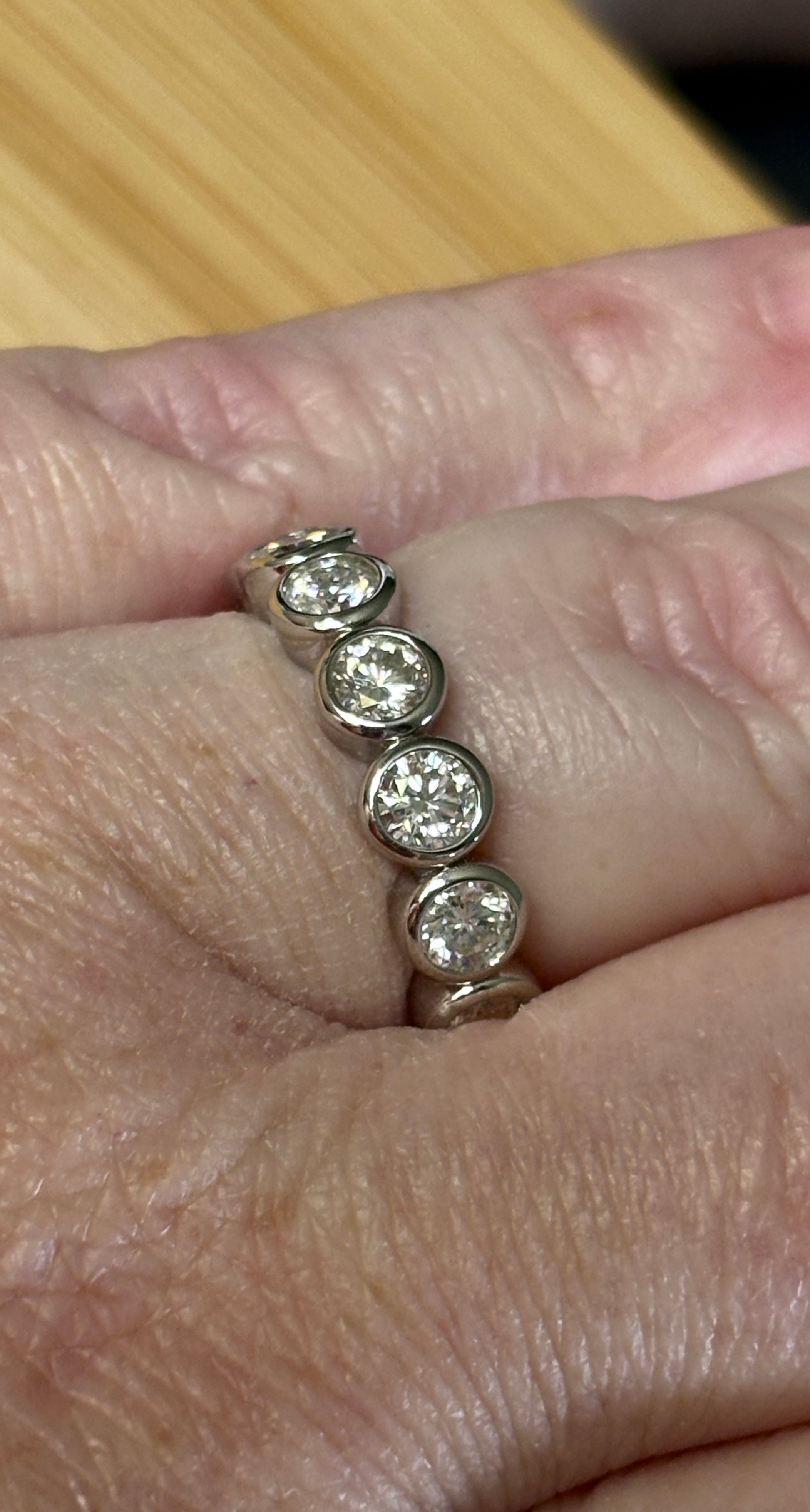 Moissanite ring. A certified, bezel-set eternity ring with 1/2ct round brilliant Moissanites set in a heavy, solid Argentium silver band!