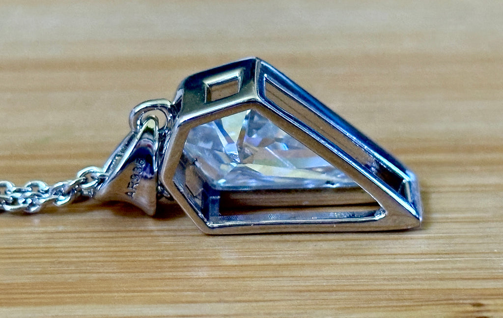 Moissanite necklace. “Flight!”, a kite-shaped, custom-cut 5ct Moissanite pendant! Hand-faceted by a master stone cutter and set in Argentium silver, it is suspended on a 20” sterling silver chain and is exclusive to Hand Knotted Jewelry!