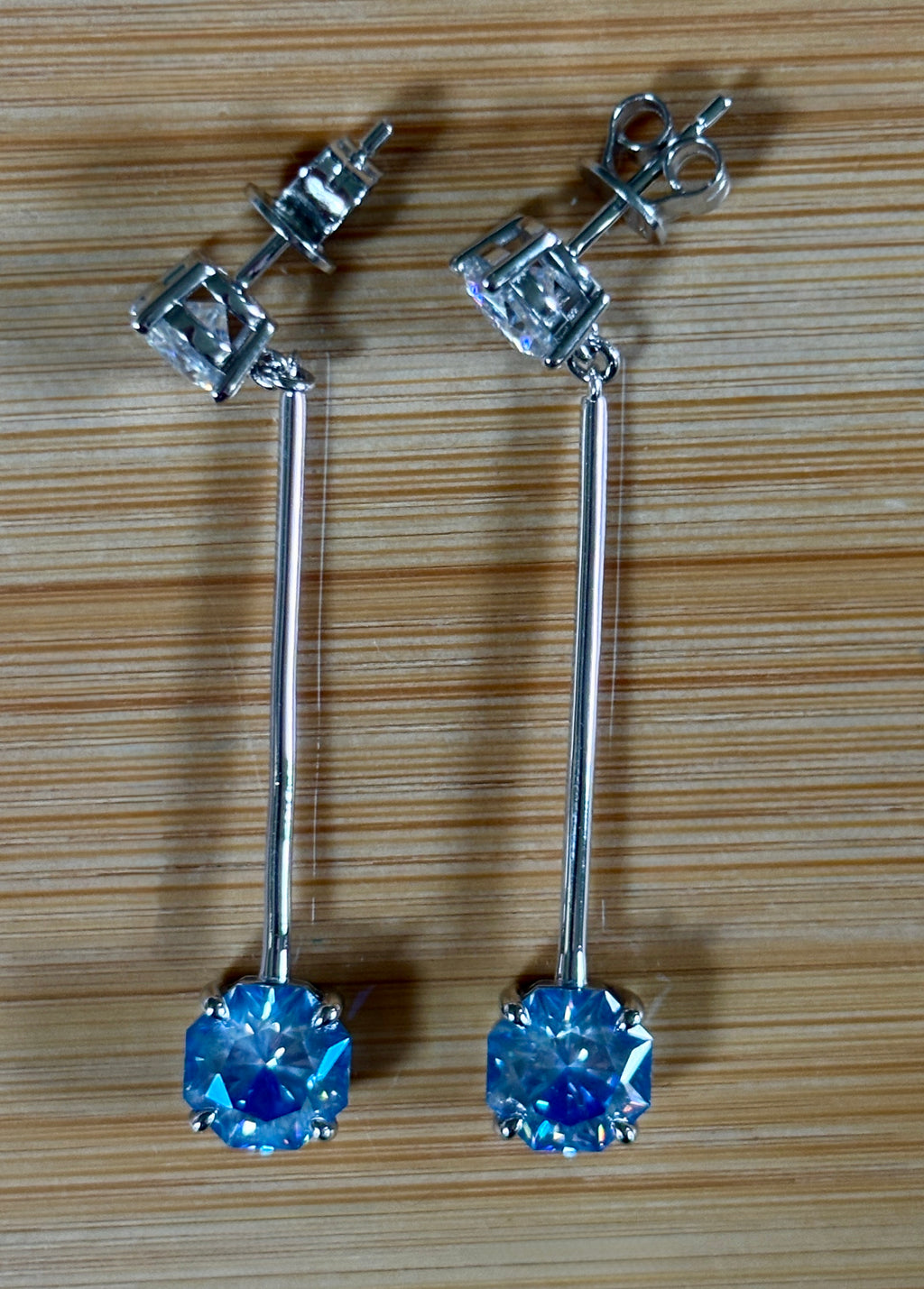 8ctw Moissanite pendulum earrings, with 3ct octagonal frosty aquamarine Moissanites at the bottom of the pendulum, and 1ct white round brilliant Moissanites at the top! Full Argentium silver construction with sterling silver disk backs! An HKJ exclusive!