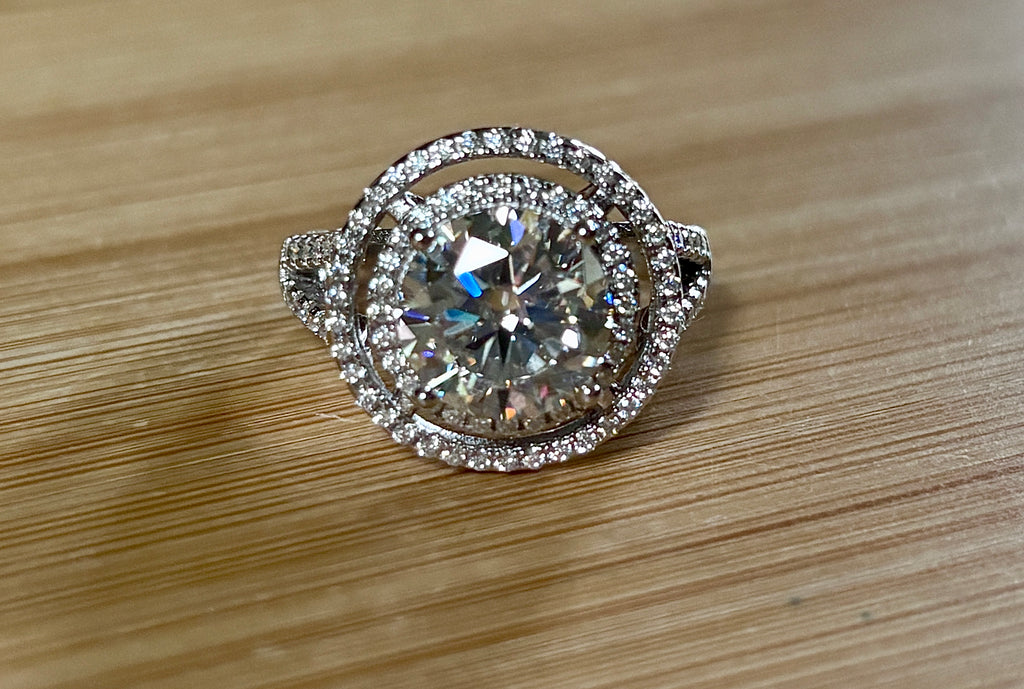 Moissanite ring. The 6.64cttw *fully* Moissanite “Bull’s Eye” ring, featuring a 4ct certified round brilliant Moissanite in a double halo!