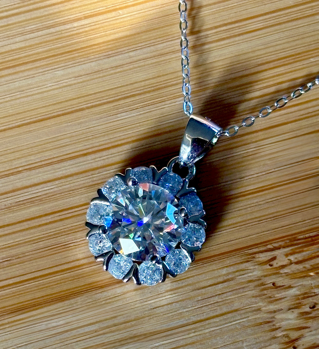 Moissanite necklace. A 3ct certified round brilliant Moissanite in a snowflake-shaped pendant ! A perfect piece for the holidays and beyond!
