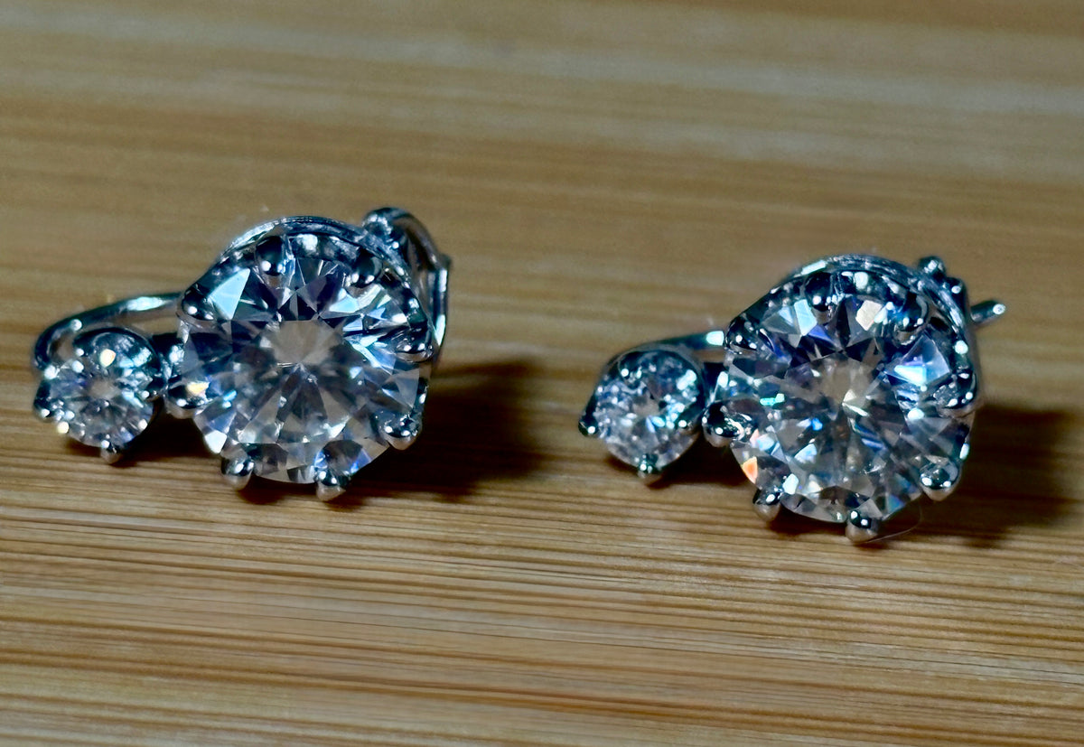 A Victorian inspired 4.2cttw certified pair of Moissanite 2-stone buckle back earrings in Argentium silver! Minimalist glam!