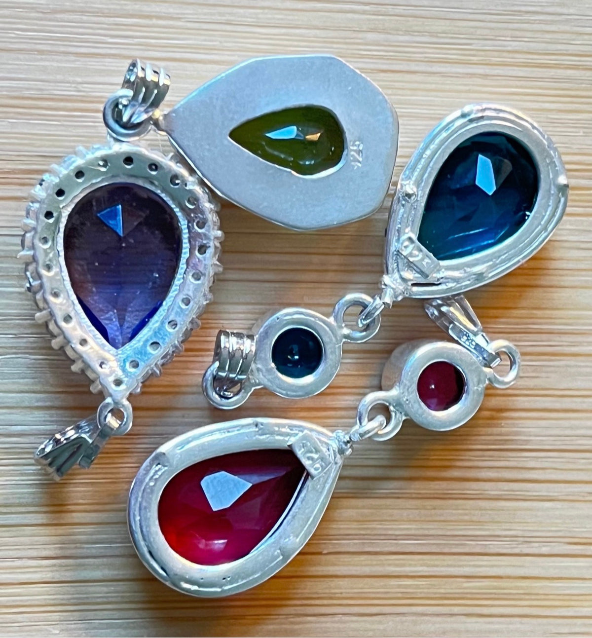 GENUINE gemstone pendants set in 925 sterling silver! Lab-grown and 100% identical to nature-grown in every way except the high price tag!