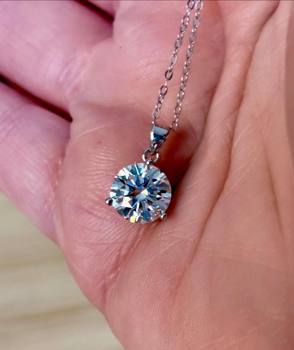 Moissanite necklace. A bright, white 3ct Moissanite solitaire in a minimalist sterling silver 3-prong mounting! Just gorgeous!