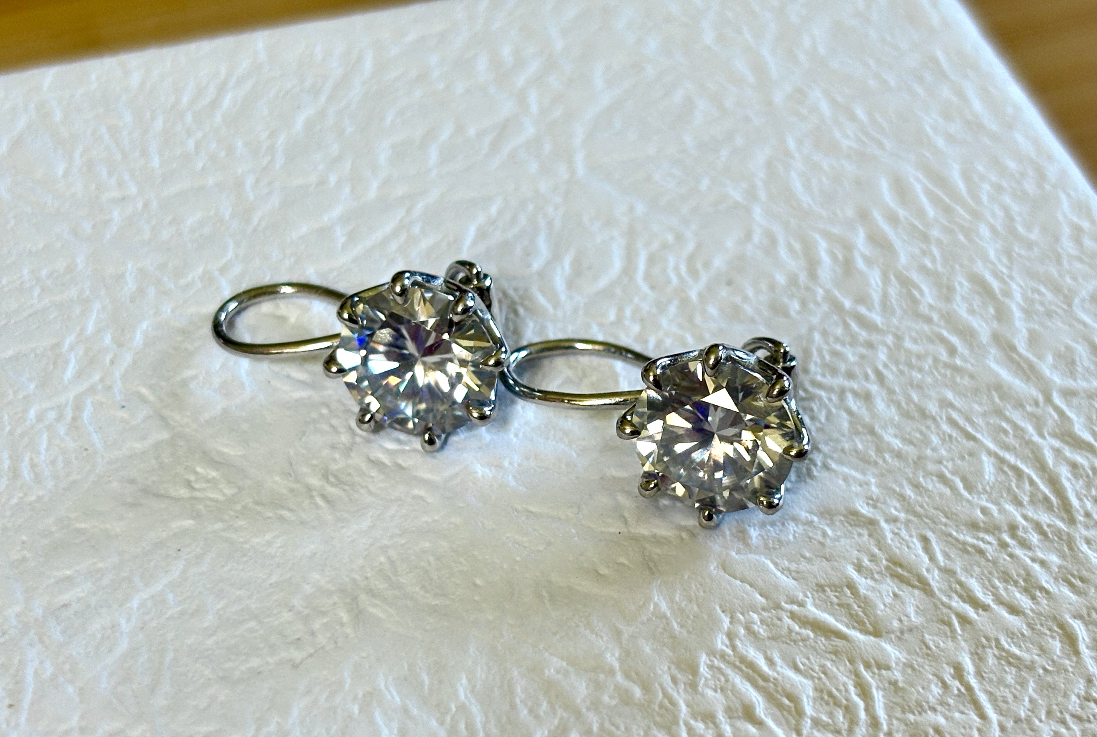 Moissanite earrings. Exclusive 8ctw double certified Moissanite fish hook earrings with *buckle backs* in 935 Argentium silver and 18k white rhodium!