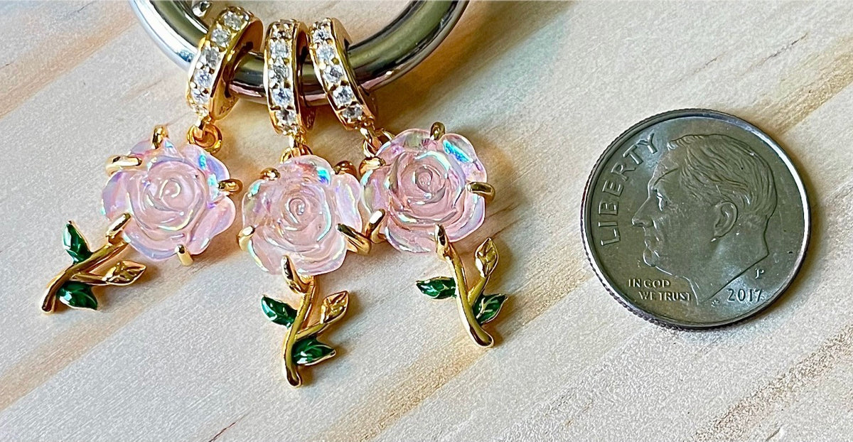 Rose charms and created opal charm! All solid sterling silver charms!