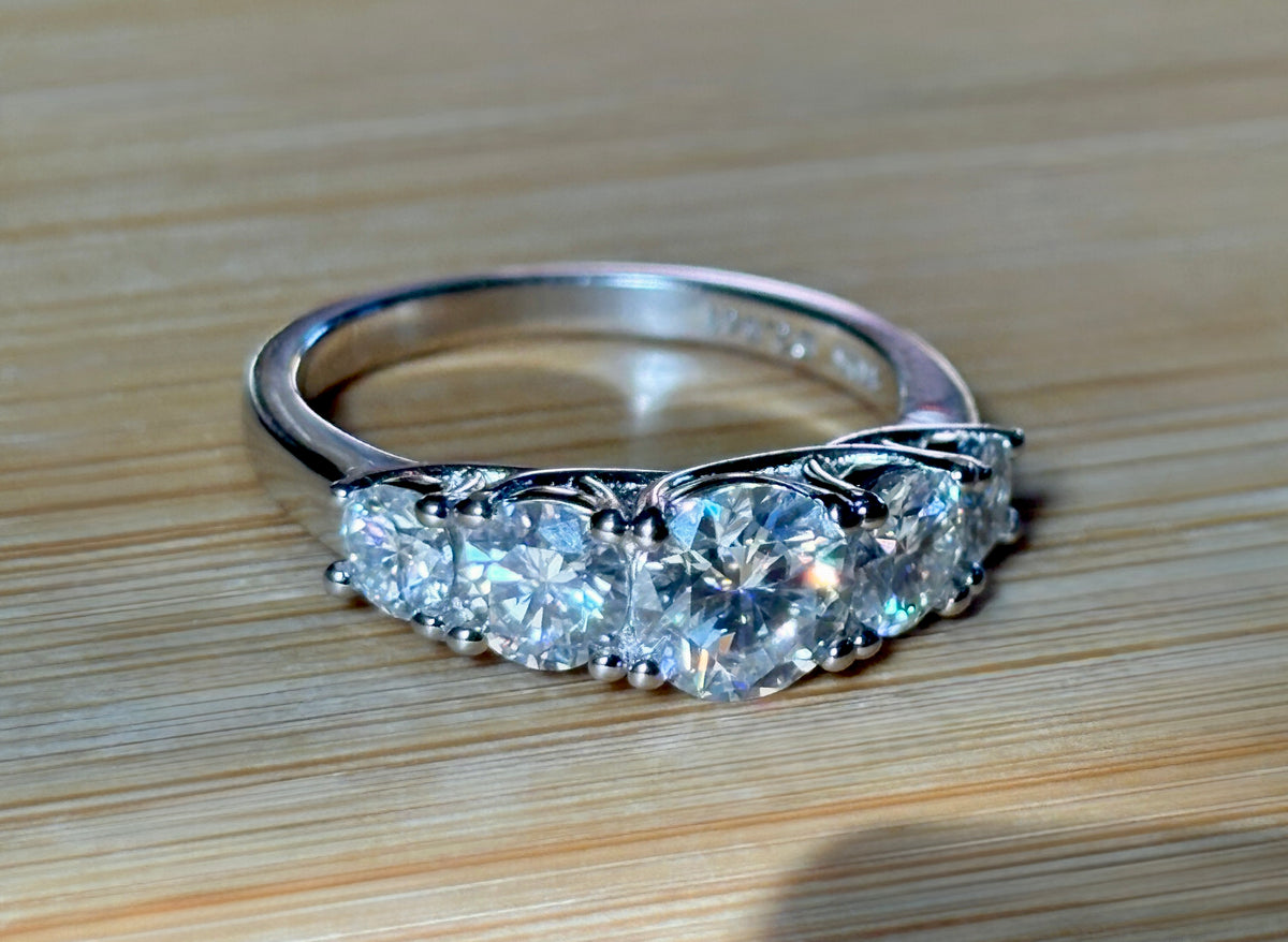 Moissanite ring. A 2.5ctw certified Moissanite ring, for those who want plenty of sparkle but a daintier ring! This feminine 5-stone design is just the thing!