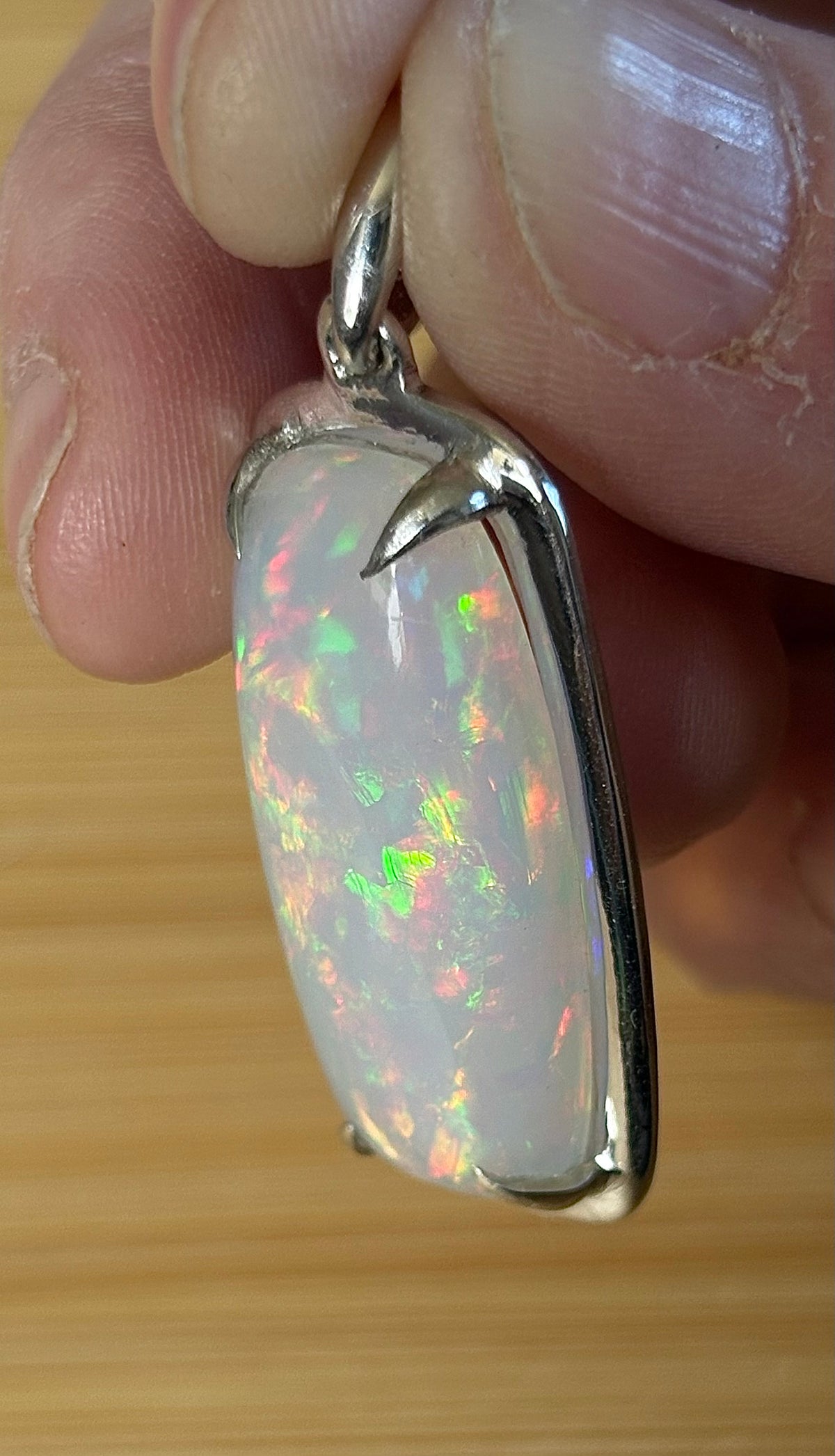 A 21ct AAA grade Ethiopian opal pendant, a handpicked opal and exclusive HKJ design! This lovely opal has gorgeous fire and play of color!