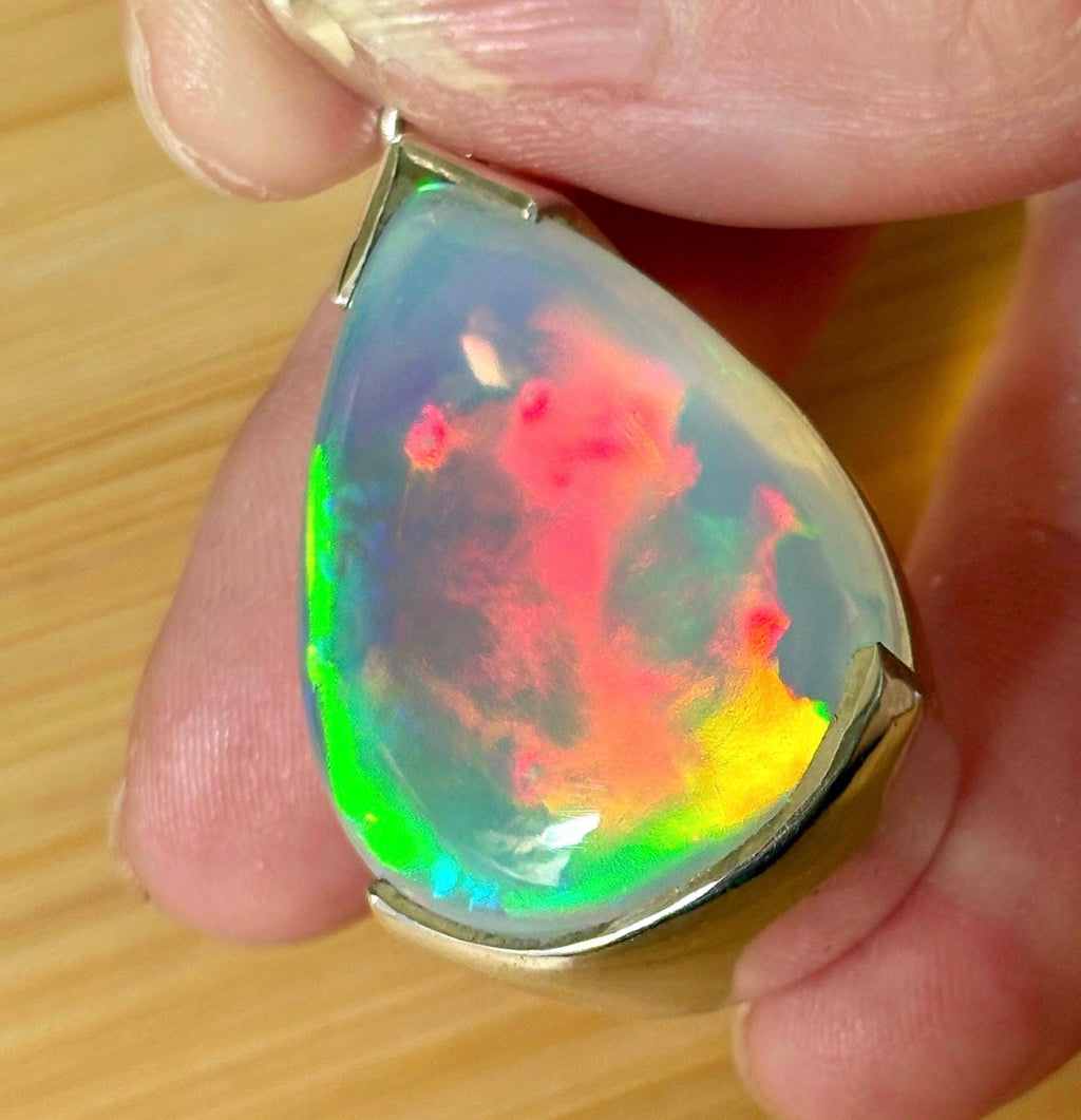 The “After the Storm” Ethiopian opal pendant, 39.18ct with rare “rolling” fire and spectacular play of color! **Collector’s grade** AAAA++