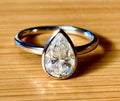 Moissanite ring. A certified 3ct pear in a hybrid basket + bezel of 925 sterling or 935 Argentium silver! A Hand Knotted Jewelry EXCLUSIVE!