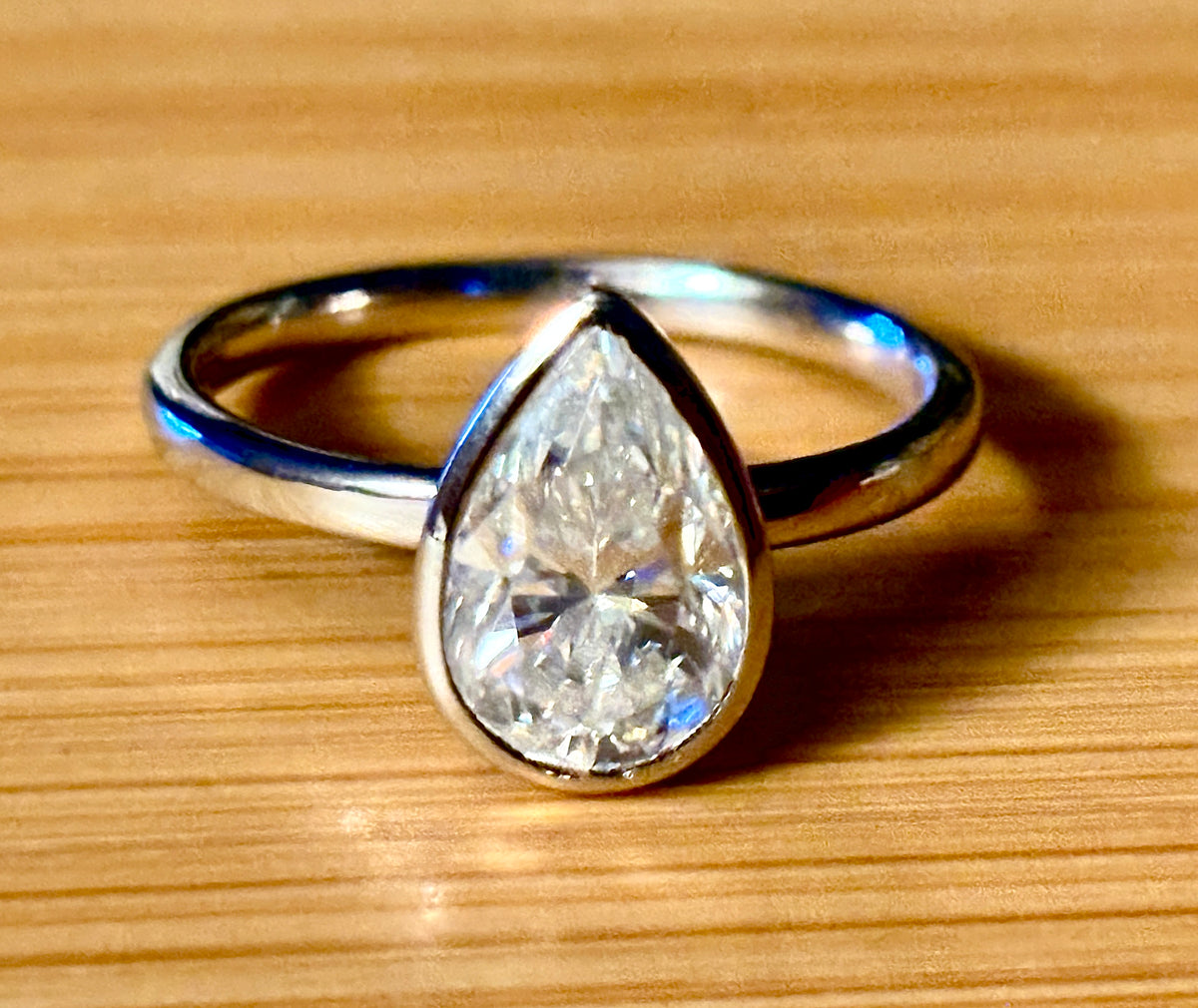 Moissanite ring. A certified 3ct pear in a hybrid basket + bezel of 925 sterling or 935 Argentium silver! A Hand Knotted Jewelry EXCLUSIVE!