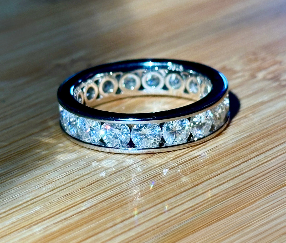 Moissanite ring. A 5.10cttw or 4.8cttw (depending on size) Moissanite eternity ring. A channel-set, classy and classic design - beautiful!
