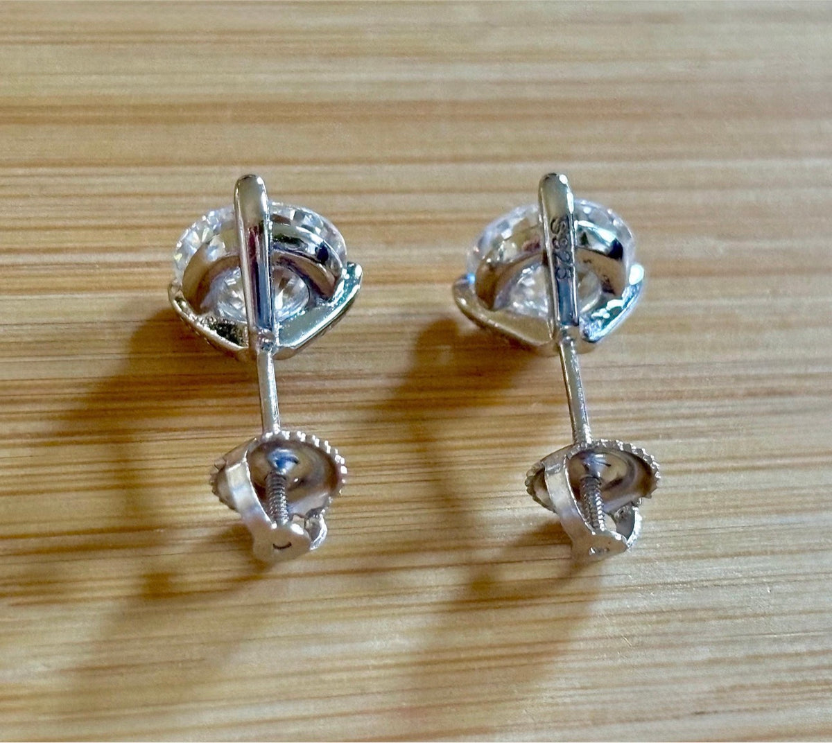 Moissanite earrings. A 4cttw certified pair of Moissanite martini studs with screw-on ear nuts - a simply elegant, classic & STUNNING pair!