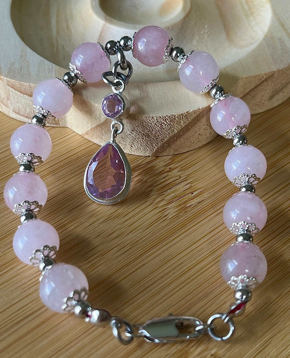 Rose quartz bracelet with 10mm Brazilian rose quartz beads and durable stainless steel components! The morganite pendant is optional.