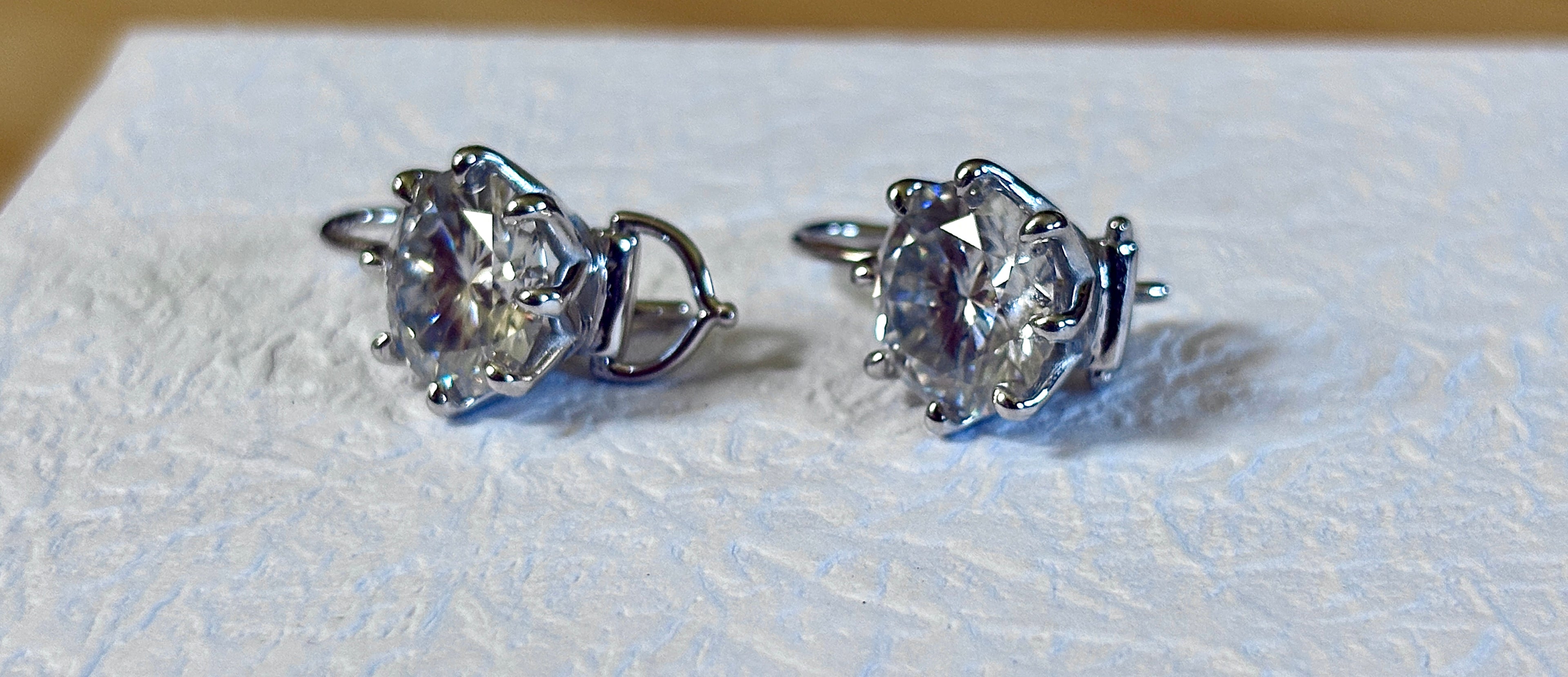 Moissanite earrings. Exclusive 8ctw double certified Moissanite fish hook earrings with *buckle backs* in 935 Argentium silver and 18k white rhodium!