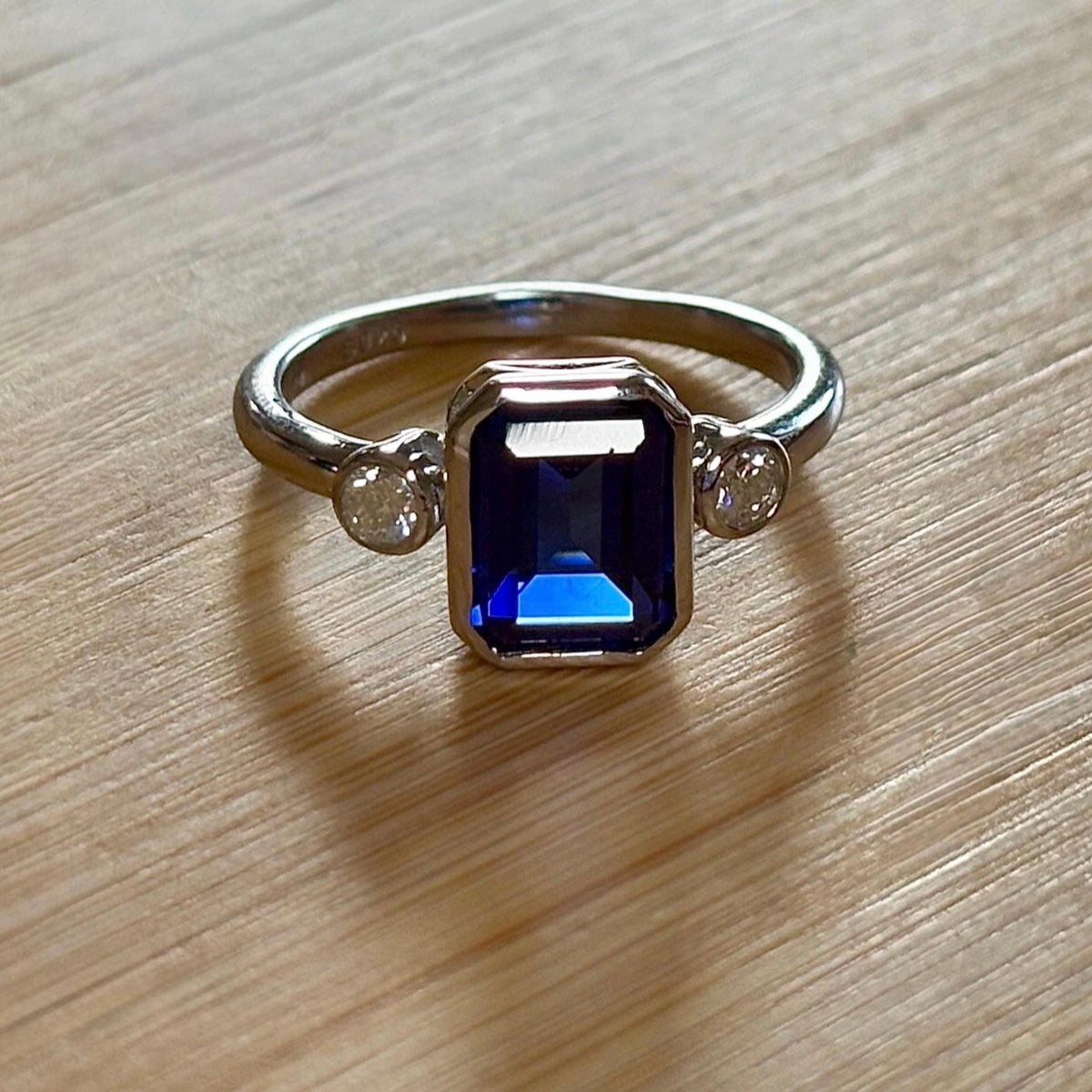 Blue sapphire and Moissanite ring. A certified 3ct lab-grown emerald-cut sapphire and .20ctw Moissanite ring in 925 sterling OR 935 Argentium!
