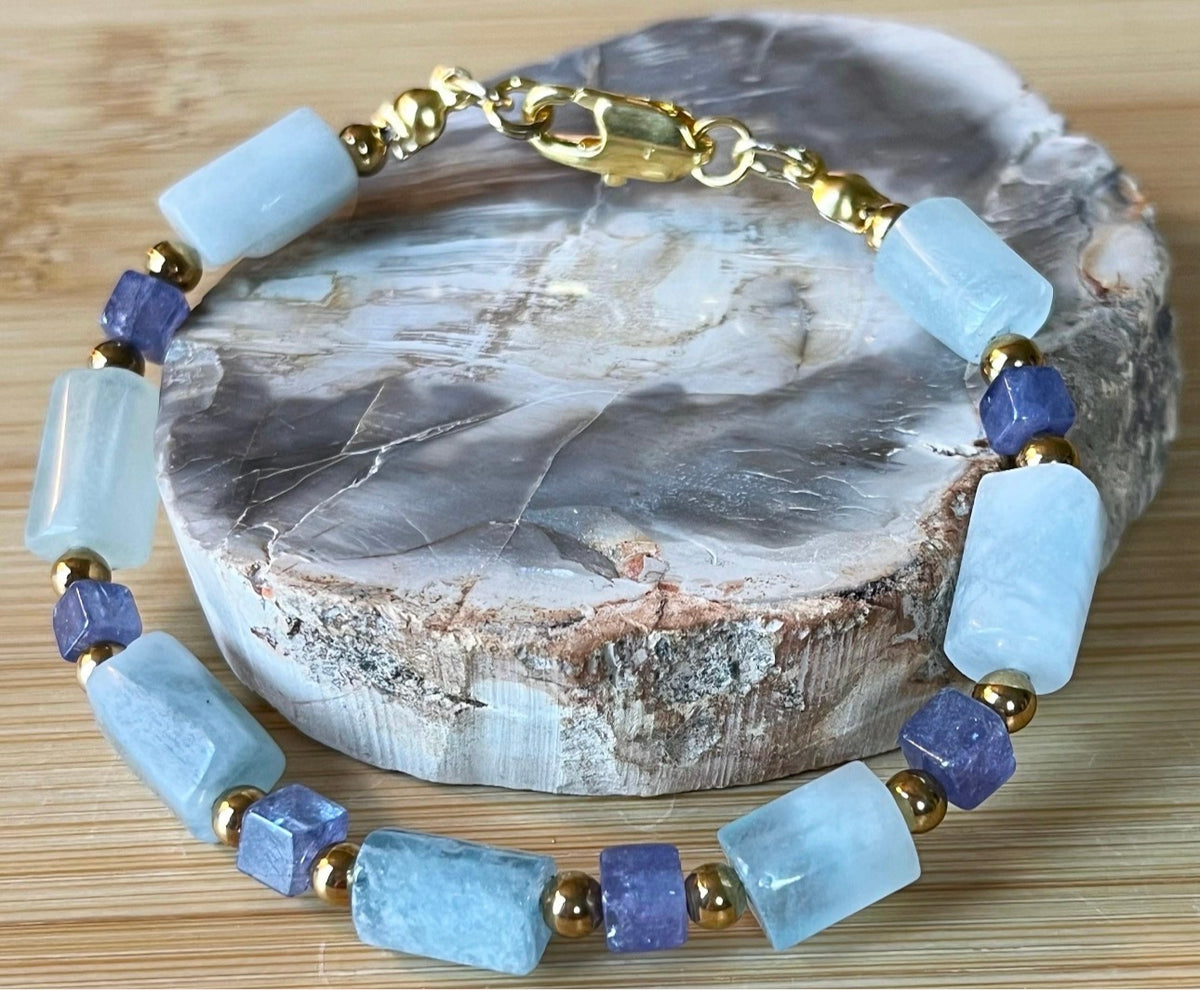 Aquamarine and tanzanite bracelet. The “True Blue” bracelet features trendy aquamarine barrels and dusky tanzanite cubes!