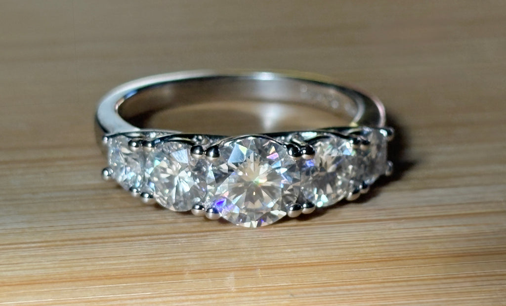 Moissanite ring. A 2.5ctw certified Moissanite ring, for those who want plenty of sparkle but a daintier ring! This feminine 5-stone design is just the thing!