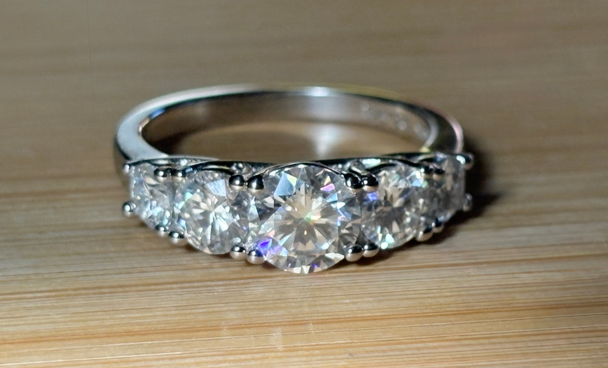 Moissanite ring. A 2.5ctw certified Moissanite ring, for those who want plenty of sparkle but a daintier ring! This feminine 5-stone design is just the thing!