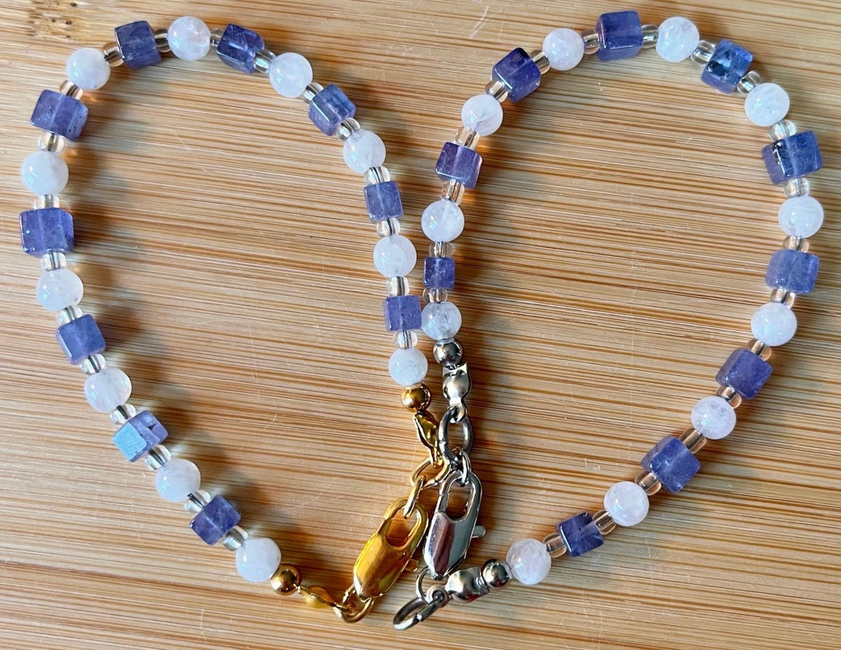 Moonstone and tanzanite bracelet. Dusky tanzanite cubes and round moonstones on stainless steel jeweler’s wire! Pretty and petite!