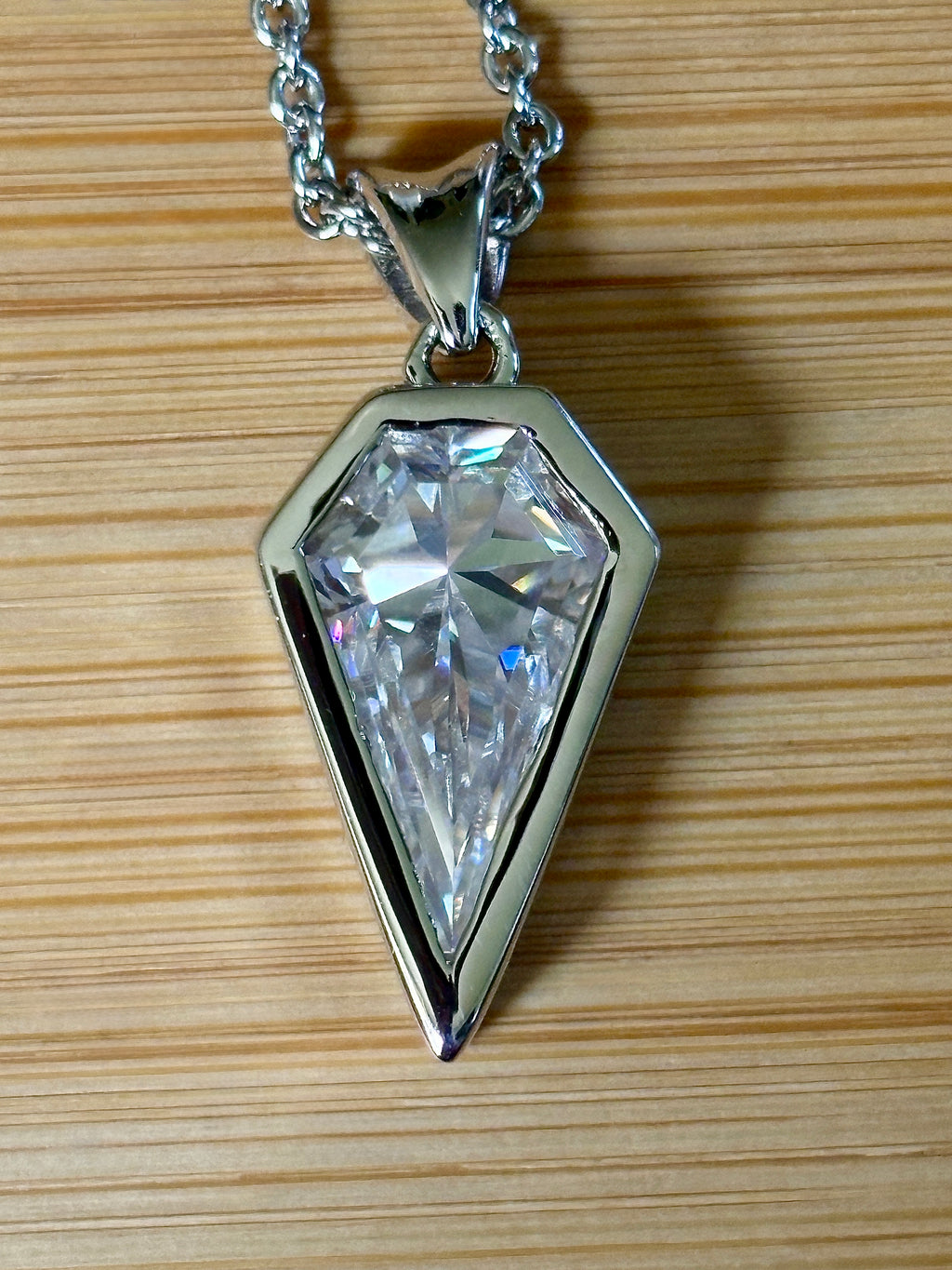 Moissanite necklace. “Flight!”, a kite-shaped, custom-cut 5ct Moissanite pendant! Hand-faceted by a master stone cutter and set in Argentium silver, it is suspended on a 20” sterling silver chain and is exclusive to Hand Knotted Jewelry!