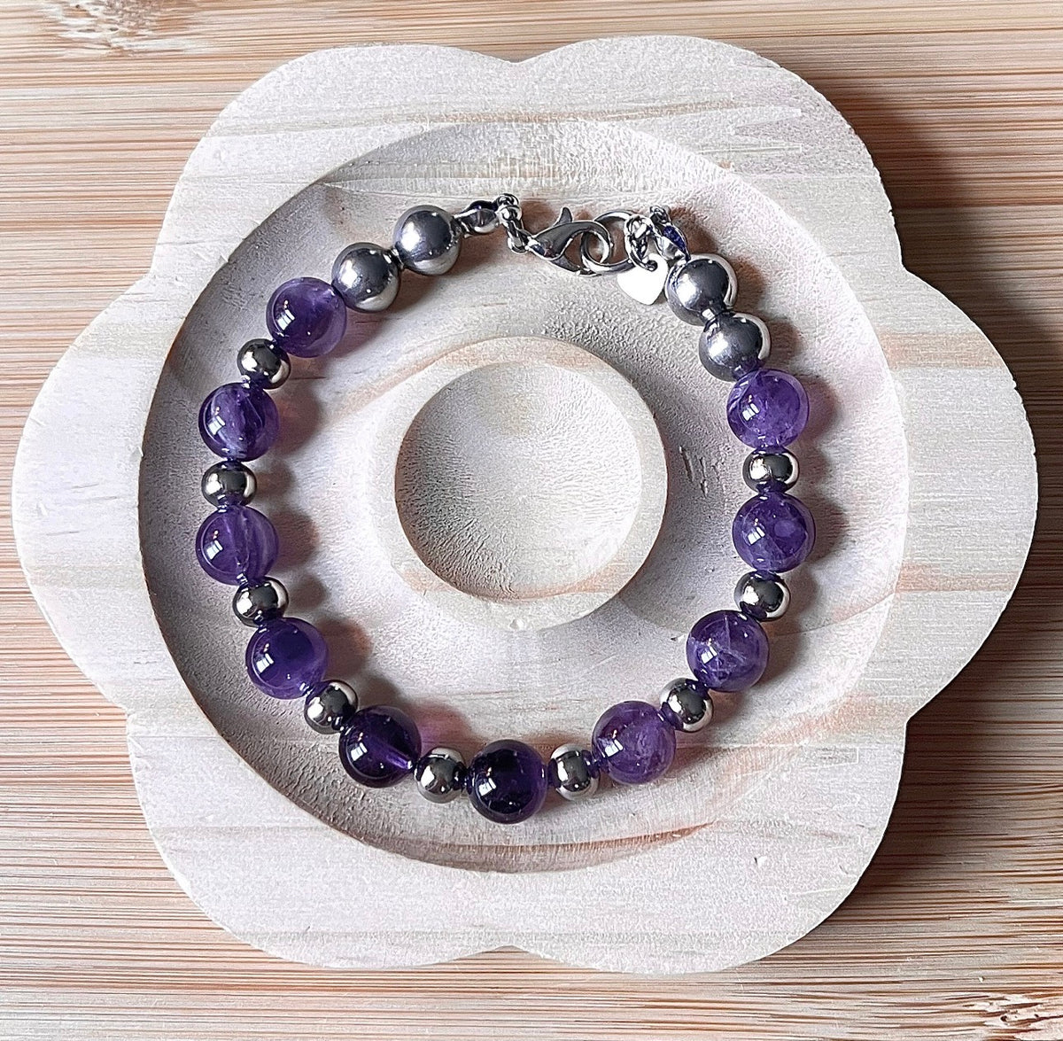 Amethyst bracelet. Pretty purple amethysts with chevron pattern crystallization! 8mm beads with durable stainless steel bracelet hardware!