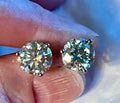 Moissanite earrings. A delicate certified 2cttw pair of 3-prong or 4-prong round brilliant Moissanites in 18k gold-embraced sterling silver baskets! Classic!