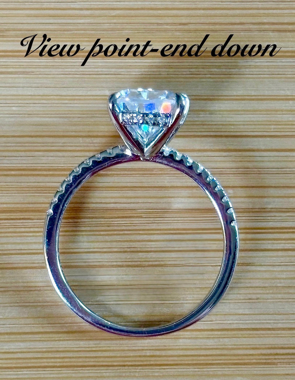 A certified 5ct pear-cut Moissanite solitaire in 925 sterling OR 935 Argentium silver with 18k, with pavé-set Moissanite shoulders and Moissanite hidden halo!