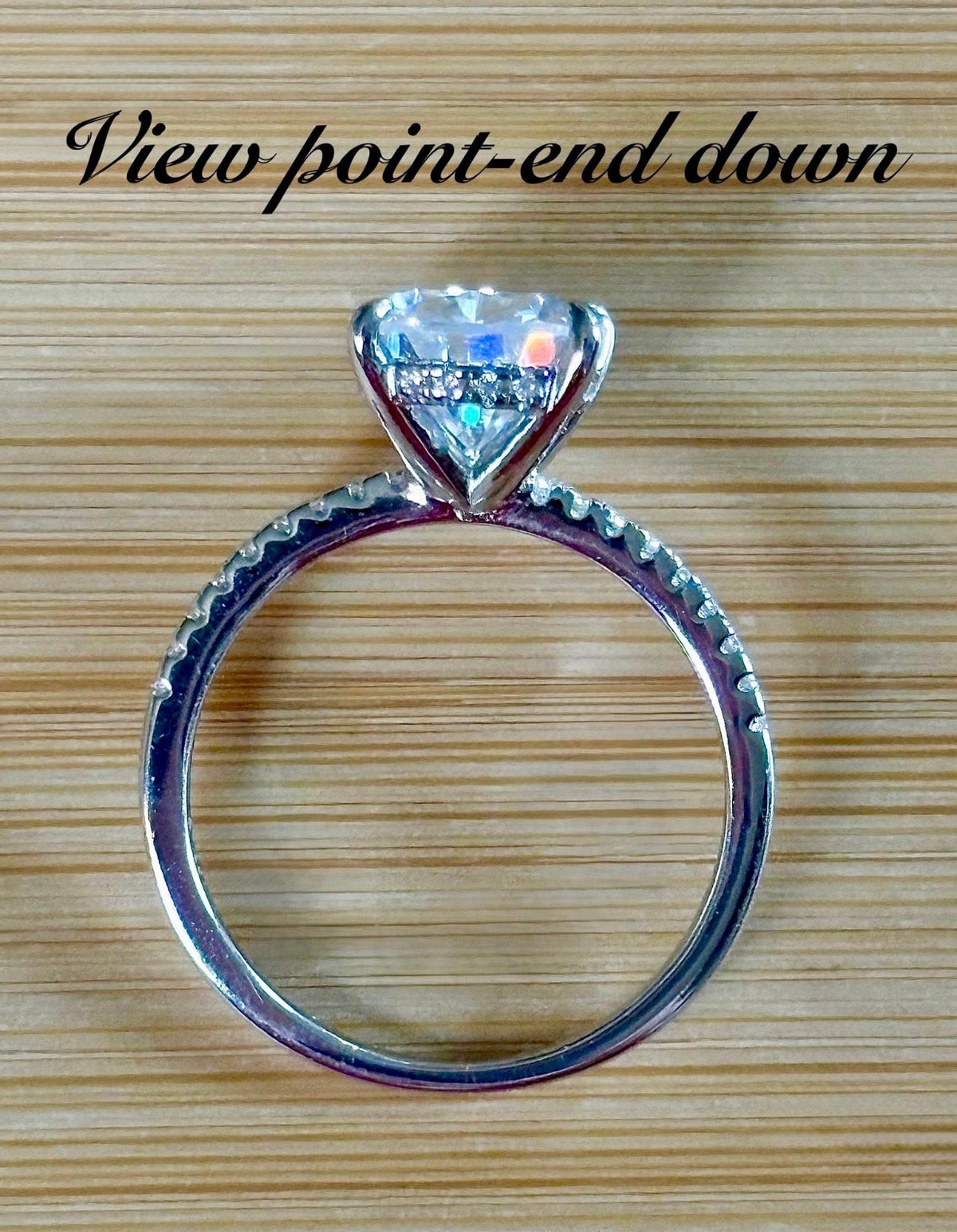 A certified 5ct pear-cut Moissanite solitaire in 925 sterling OR 935 Argentium silver with 18k, with pavé-set Moissanite shoulders and Moissanite hidden halo!