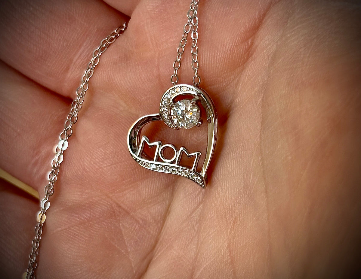 Moissanite necklace. A certified 1/2ct round radiant Moissanite in a pendant just for your mom or because you’re a mom, in sterling silver with zircon accents!