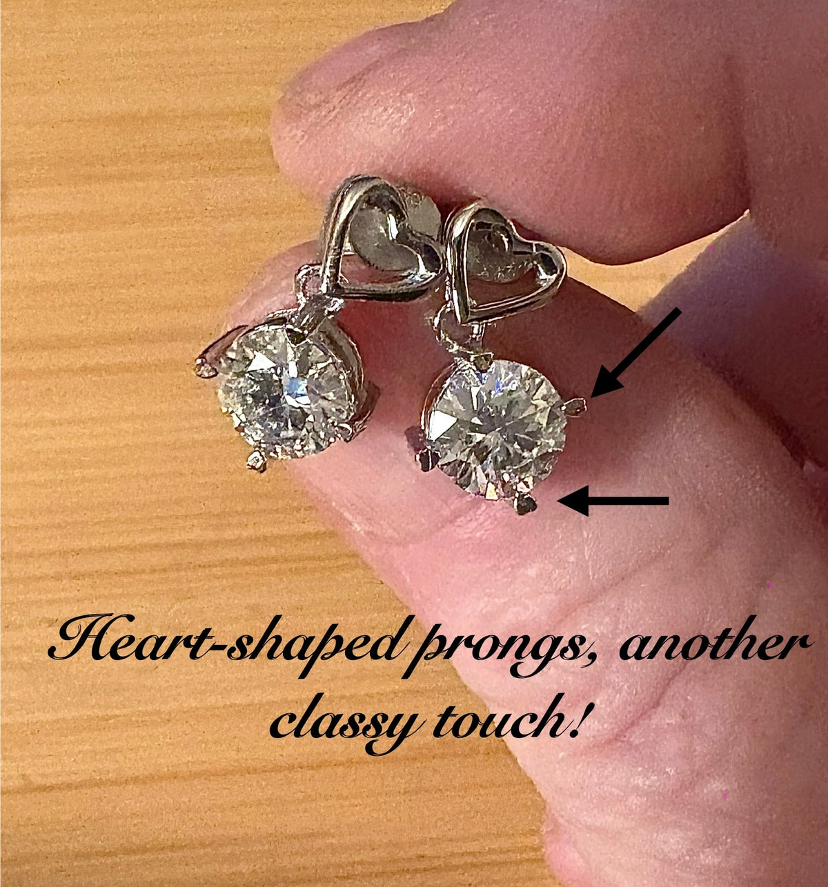 Moissanite earrings. Certified 2cttw round brilliant Moissanites dangling from heart-shaped posts are perfect for your Valentine (or you)!