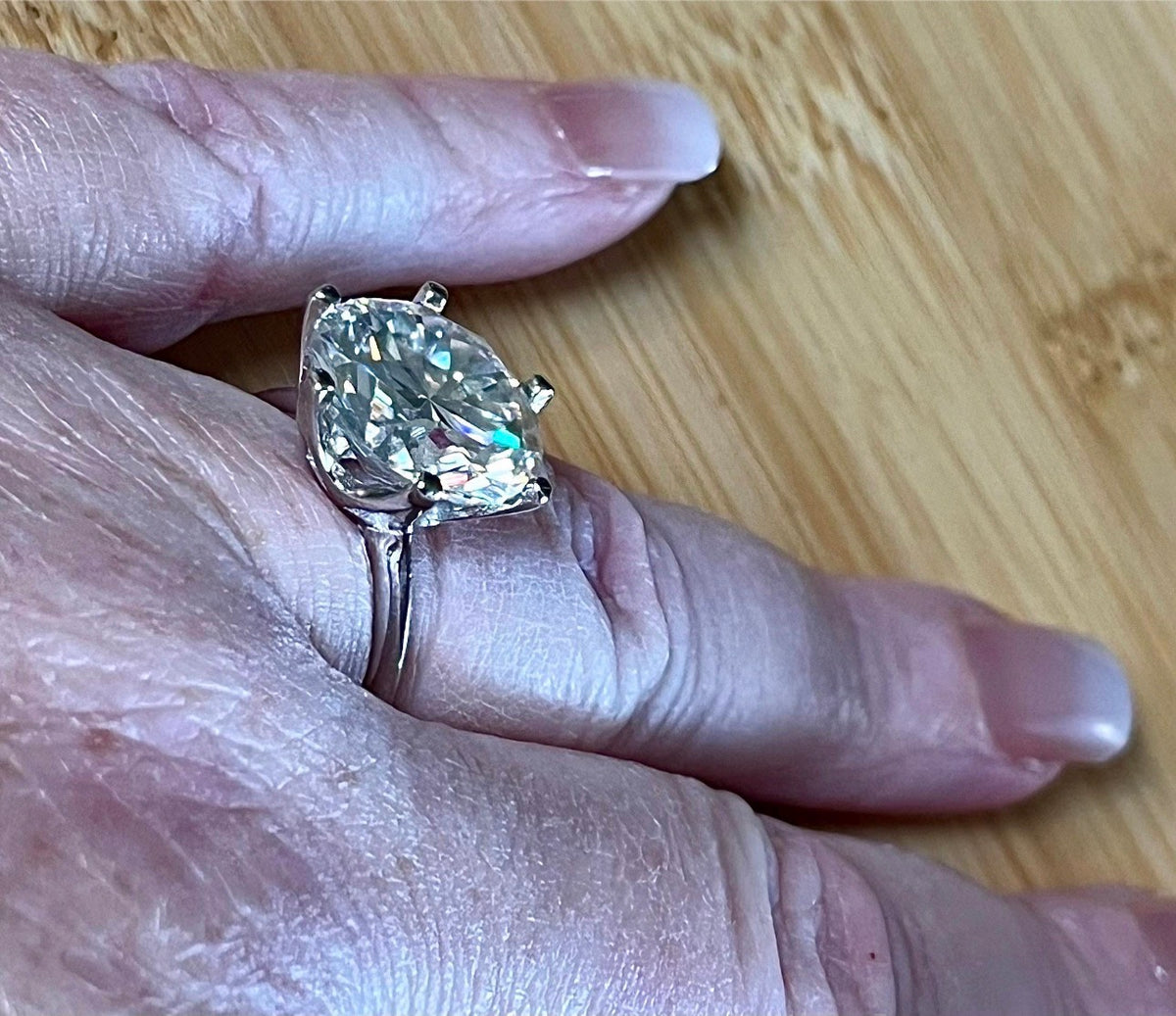 Moissanite ring. A gorgeous 10ct certified round brilliant Moissanite in a lovely crown setting, with 6 prongs and a sleek plain band!