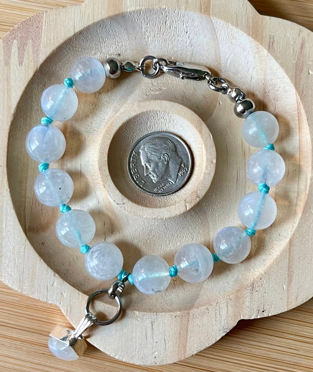 Rainbow moonstone bracelet, hand knotted with high quality 9-10mm beads! The solid sterling silver moonstone pendant is *optional*.