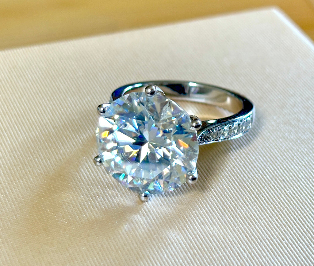 Moissanite ring. The 10ct certified 8H8A Moissanite “Tulip” statement ring with .50cttw Moissanite accents! Photos fail this GORGEOUS ring!