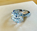 Moissanite ring. The 10ct certified 8H8A Moissanite “Tulip” statement ring with .50cttw Moissanite accents! Photos fail this GORGEOUS ring!