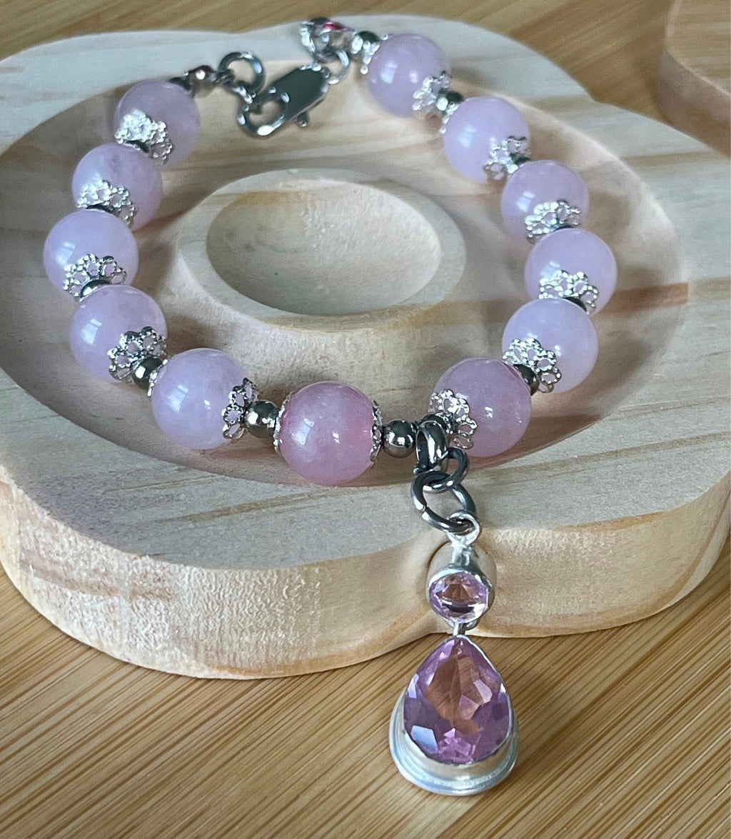 Rose quartz bracelet with 10mm Brazilian rose quartz beads and durable stainless steel components! The morganite pendant is optional.