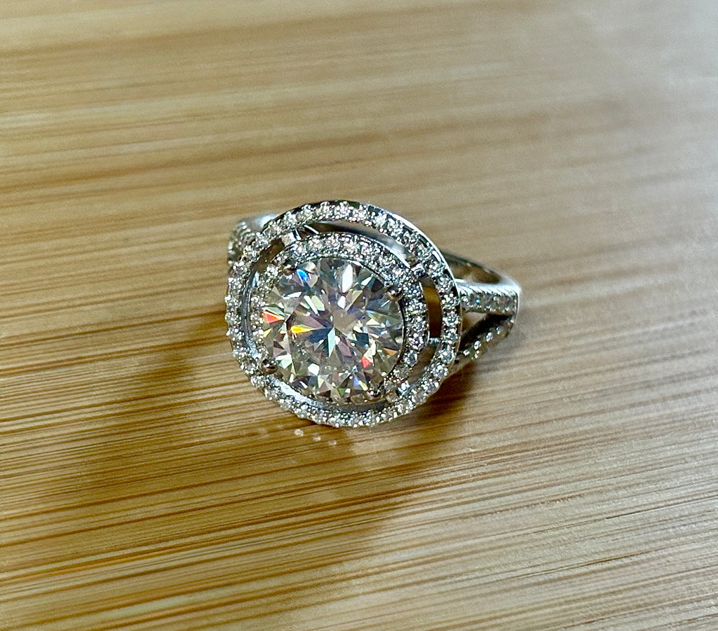 Moissanite ring. The 6.64cttw *fully* Moissanite “Bull’s Eye” ring, featuring a 4ct certified round brilliant Moissanite in a double halo!